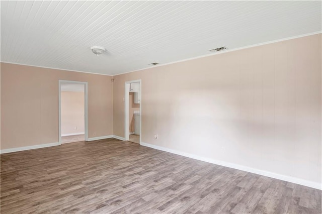 spare room featuring light wood-type flooring