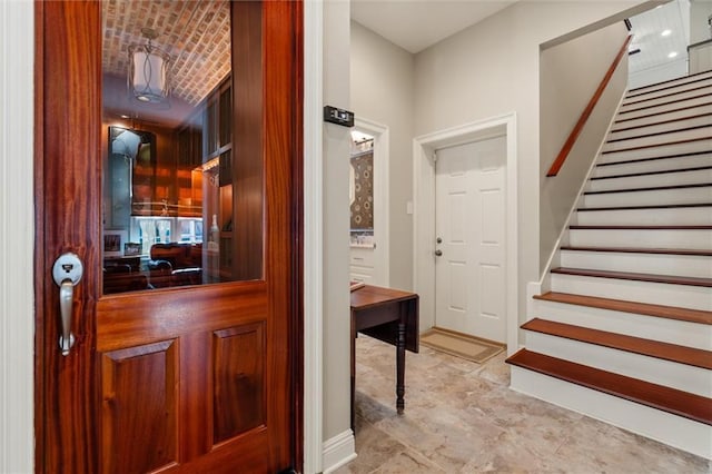 foyer with brick ceiling