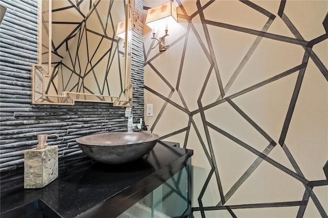 bathroom featuring decorative backsplash and sink