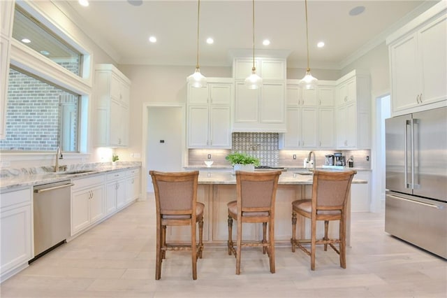 8529 Crepe Myrtle Ct, Mobile, AL 36619 - kitchen featuring a sink, appliances with stainless steel finishes, white cabinets, and backsplash