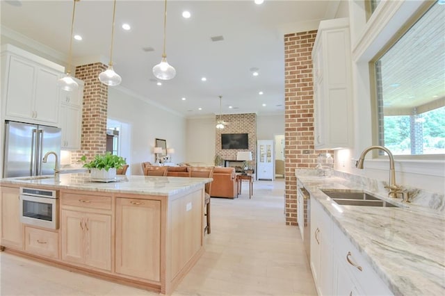 8529 Crepe Myrtle Ct, Mobile, AL 36619 - kitchen featuring crown molding, high end fridge, white oven, light stone counters, and a sink
