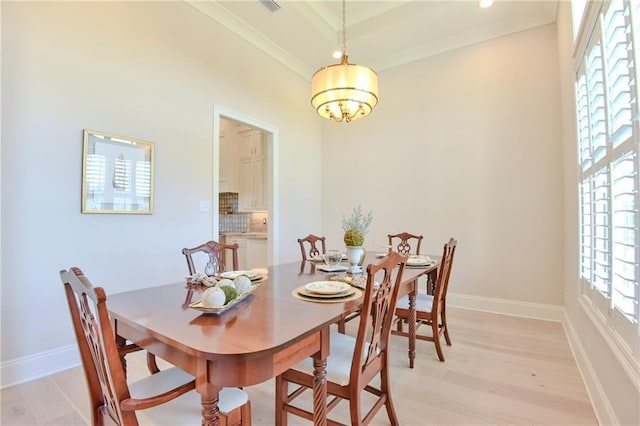 8529 Crepe Myrtle Ct, Mobile, AL 36619 - dining area featuring baseboards, light wood-style flooring, a chandelier, and a wealth of natural light