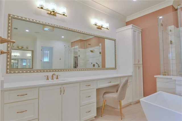 8529 Crepe Myrtle Ct, Mobile, AL 36619 - bathroom with vanity, tile patterned floors, ornamental molding, a soaking tub, and a stall shower