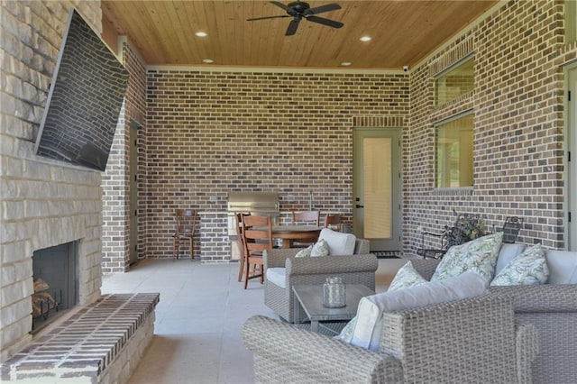 8529 Crepe Myrtle Ct, Mobile, AL 36619 - view of patio / terrace with a ceiling fan, an outdoor living space with a fireplace, and an outdoor kitchen