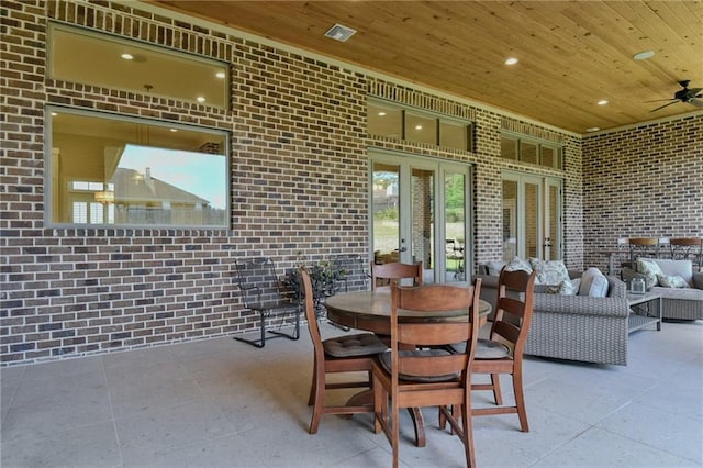 8529 Crepe Myrtle Ct, Mobile, AL 36619 - dining room with brick wall, ceiling fan, wood ceiling, and visible vents