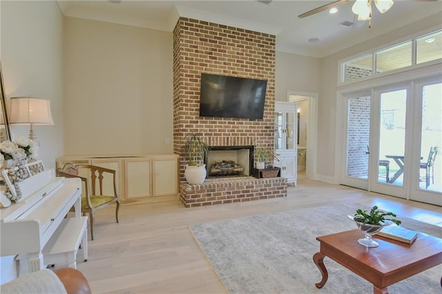 8529 Crepe Myrtle Ct, Mobile, AL 36619 - living area with light wood-style floors, ornamental molding, ceiling fan, and a healthy amount of sunlight