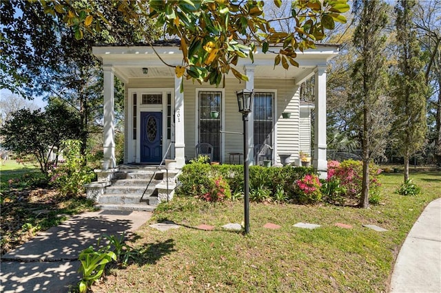 201 Catherine St S, Mobile, AL 36604 - shotgun-style home featuring covered porch and a front lawn