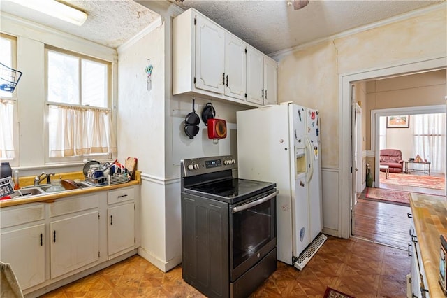 201 Catherine St S, Mobile, AL 36604 - kitchen featuring white cabinetry, stainless steel electric range, a textured ceiling, and a sink