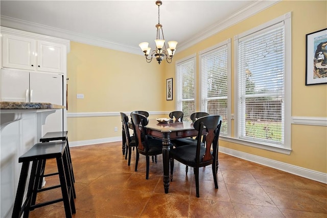 dining area featuring dark tile patterned flooring, crown molding, and an inviting chandelier