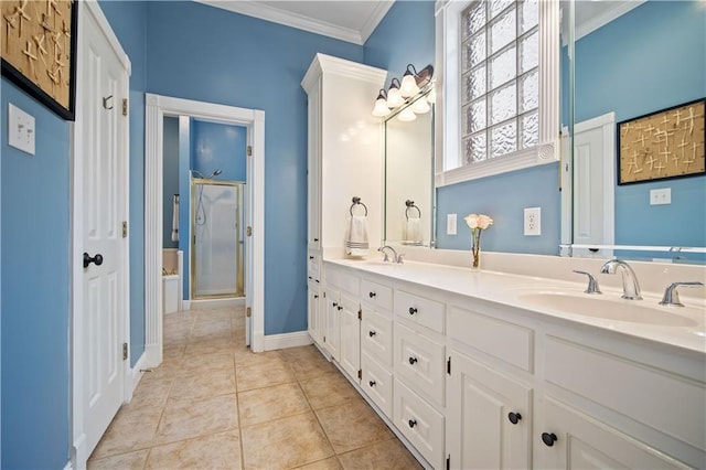 bathroom featuring tile patterned flooring, vanity, ornamental molding, and walk in shower