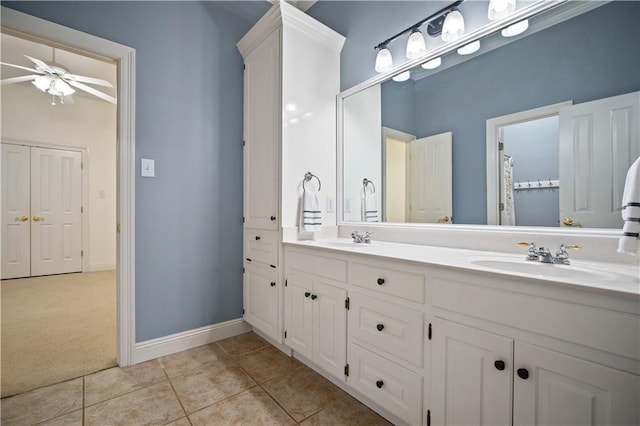 bathroom with tile patterned floors, ceiling fan, and vanity