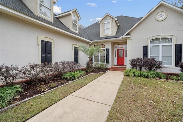 property entrance featuring a yard