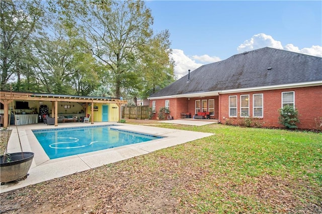 view of swimming pool with a lawn, a patio area, and an outdoor hangout area