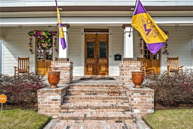 doorway to property with a porch