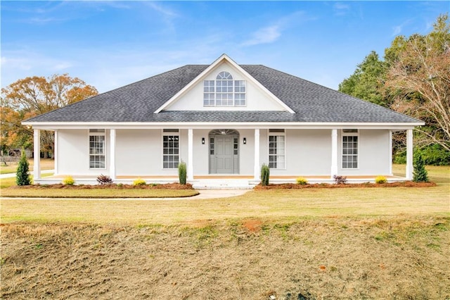 country-style home featuring covered porch and a front lawn