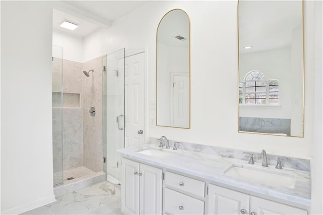 bathroom with walk in shower and vanity