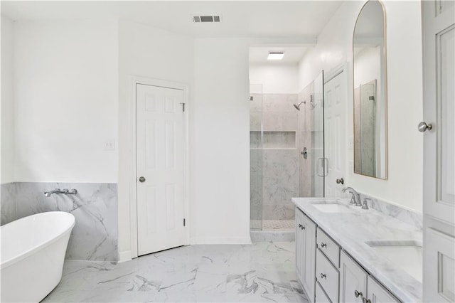 bathroom with shower with separate bathtub, vanity, and tile walls