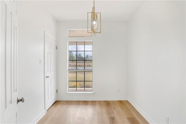 unfurnished dining area featuring light hardwood / wood-style flooring