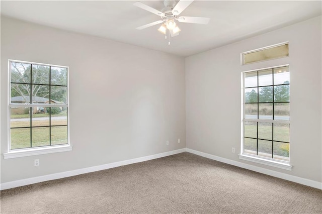 carpeted empty room with ceiling fan