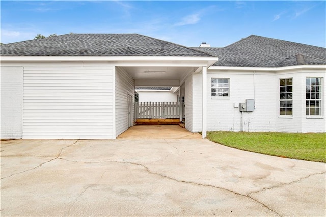 view of property exterior with a carport