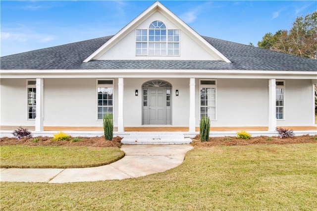 view of front of house featuring a front yard and covered porch