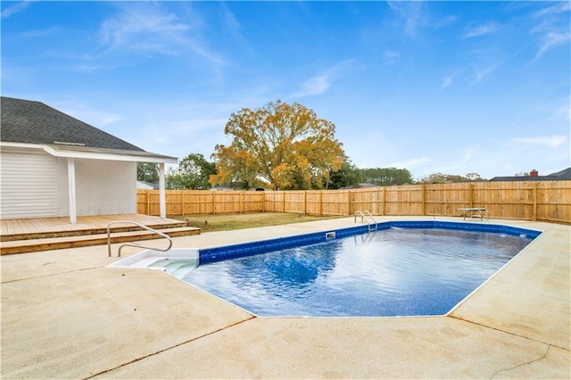 view of pool featuring a deck and a patio area