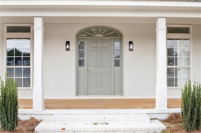 doorway to property with covered porch