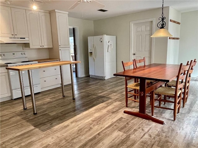 dining room featuring ceiling fan and light hardwood / wood-style floors