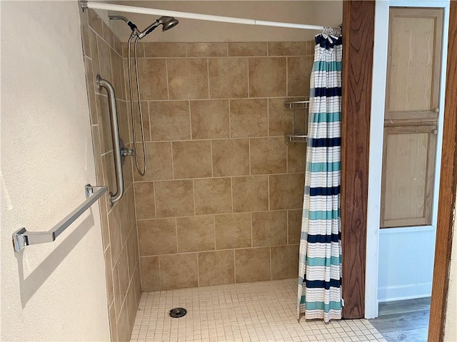 bathroom featuring walk in shower and hardwood / wood-style floors