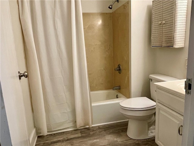 full bathroom featuring shower / bath combo, hardwood / wood-style floors, toilet, and vanity