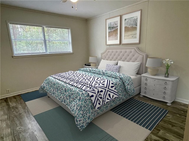 bedroom with ceiling fan and dark wood-type flooring