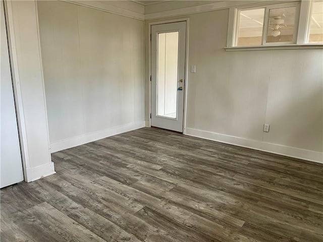 spare room with dark hardwood / wood-style flooring