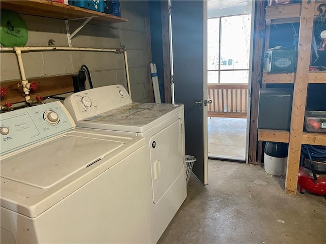 clothes washing area featuring washer and dryer