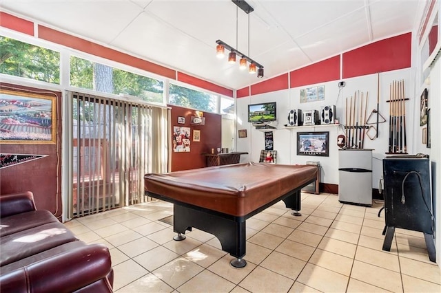 game room with light tile patterned floors, lofted ceiling, and pool table