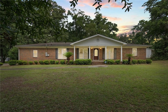1113 4th Ave, Saraland, AL 36571 - ranch-style house featuring a yard, brick siding, and covered porch