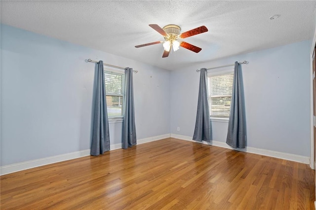 1113 4th Ave, Saraland, AL 36571 - unfurnished room featuring a textured ceiling, ceiling fan, and light wood-type flooring