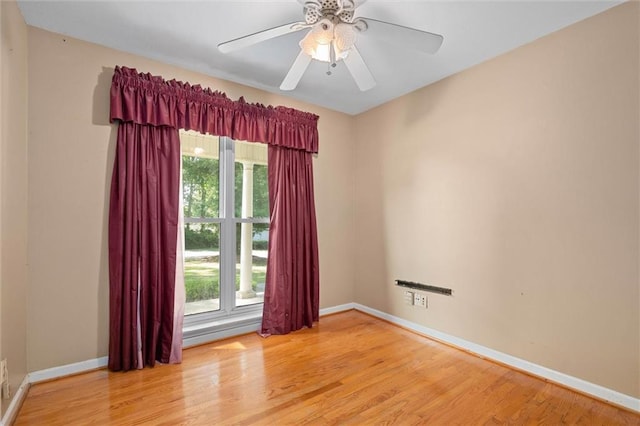 1113 4th Ave, Saraland, AL 36571 - empty room featuring healthy amount of natural light, wood finished floors, and ceiling fan