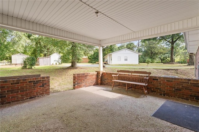 1113 4th Ave, Saraland, AL 36571 - view of patio / terrace featuring a storage shed
