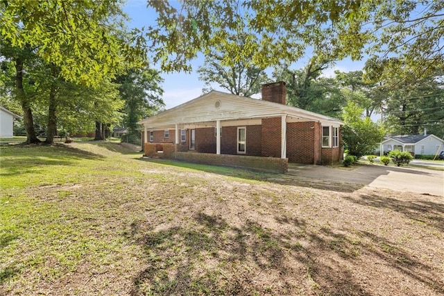 1113 4th Ave, Saraland, AL 36571 - view of front of property featuring a chimney, a front lawn, and brick siding