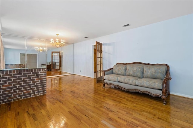 1113 4th Ave, Saraland, AL 36571 - living room with a chandelier and wood finished floors
