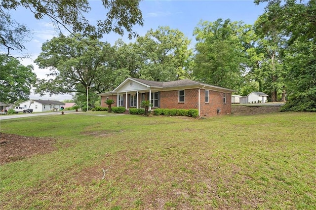 1113 4th Ave, Saraland, AL 36571 - ranch-style home featuring brick siding and a front yard