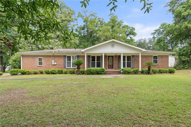 1113 4th Ave, Saraland, AL 36571 - single story home featuring a front lawn, covered porch, and brick siding