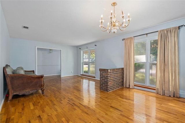 1113 4th Ave, Saraland, AL 36571 - living room featuring a chandelier and light wood finished floors