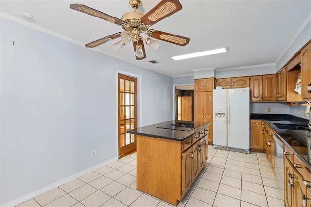 1113 4th Ave, Saraland, AL 36571 - kitchen featuring white fridge with ice dispenser, a kitchen island, dark countertops, black electric cooktop, and crown molding