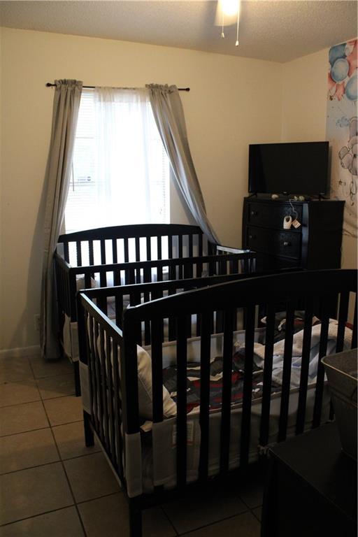 2517 Pinecliff Ct N, Mobile, AL 36605 - bedroom featuring tile patterned floors