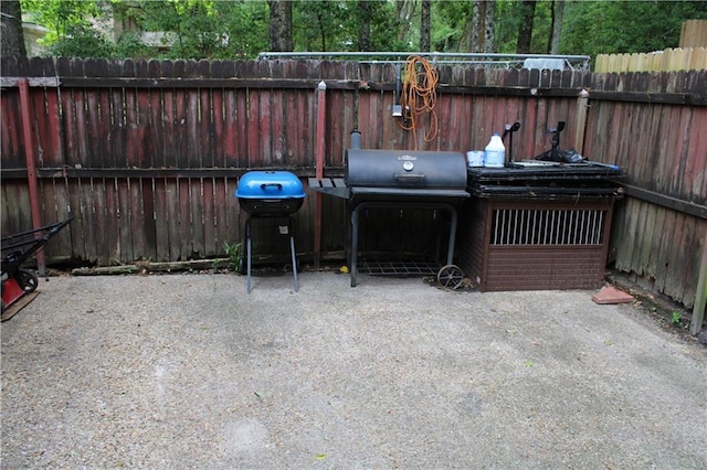 2517 Pinecliff Ct N, Mobile, AL 36605 - view of patio featuring fence and a grill