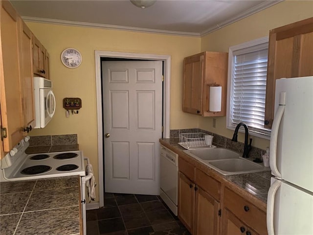 kitchen with ornamental molding, white appliances, dark tile patterned floors, and sink