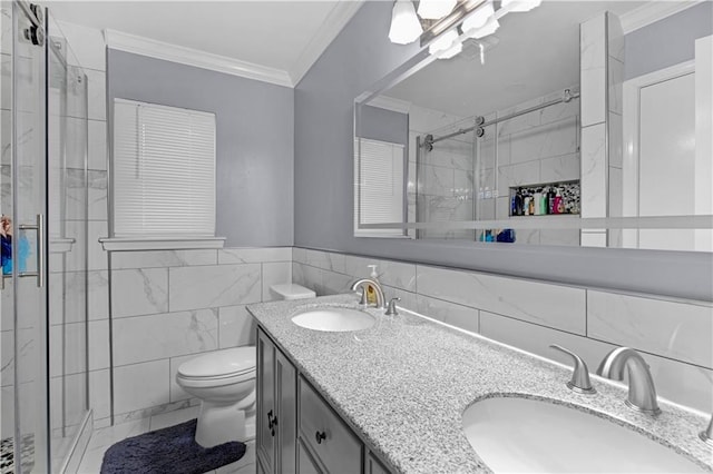 full bath featuring a stall shower, tile walls, ornamental molding, and a sink