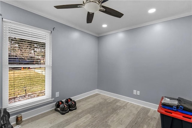 unfurnished room with recessed lighting, crown molding, baseboards, and wood finished floors