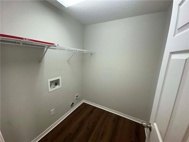 laundry area featuring hookup for a washing machine, electric dryer hookup, hardwood / wood-style floors, and a textured ceiling